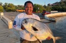 Jadriel “JJ” John holds a pompano he caught off the pier at Altona Lagoon using a handline. This photo is among those posted to John’s social media accounts in April 2025.