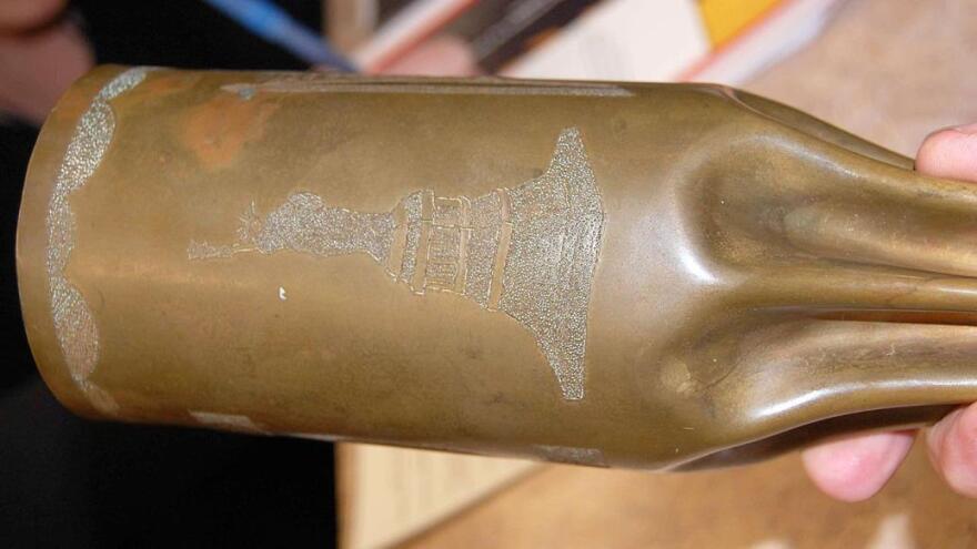 The Statue of Liberty is etched into an artillery shell casing in this example of “trench art,” objects created by soldiers as mementos of war. The piece was part of a “We Will Remember Them” WWI roadshow at USU in 2018.