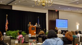 Department of Justice specialist Ken Bergeron and Women4Change Indiana executive director Rima Shahid address an Indiana Civil Rights Commission Conference.