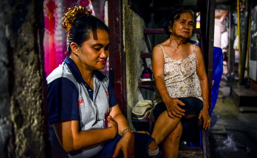 Marcelina Mallari (right) and her daughter Gina share the heartache of losing Robert, Mallari's son and Gina's brother, in the drug war.