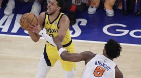 Indiana Pacers guard Tyrese Haliburton (0) is fouled by New York Knicks forward OG Anunoby (8) during the first quarter of Game 5 of the NBA basketball Eastern Conference final, Thursday, May 29, 2025, in New York.