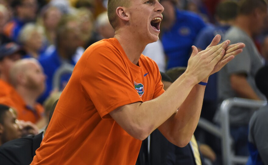 Florida's Alex Murphy claps for his teammates from the bench. Murphy is currently on the injured list. (Greenberry Taylor/WUFT News)