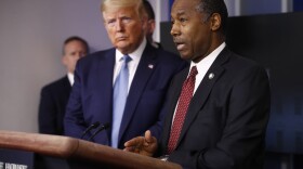 President Trump listens as Housing and Urban Development Secretary Ben Carson speak during a coronavirus task force briefing in March. (Patrick Semansky/AP)