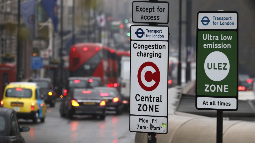 Signs in London designate the Ultra Low Emission and Congestion Charging zones for cars driven into the city's center.