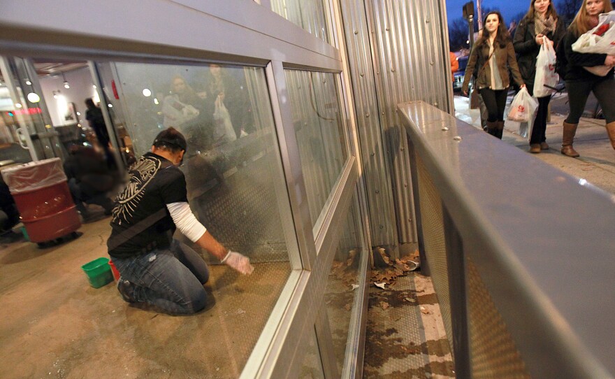 Workers clean a closed Chipotle restaurant in Boston in December after customers became infected with norovirus.