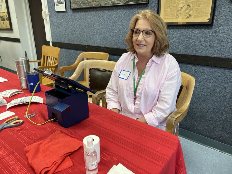Ironton City Clerk Emma Pratt checks in voters Tuesday, Aug. 13, 2024, on Primary Election Day at Ironton City Hall. In her clerk role for about a year, the lifelong resident is serving as an election judge for the first time.