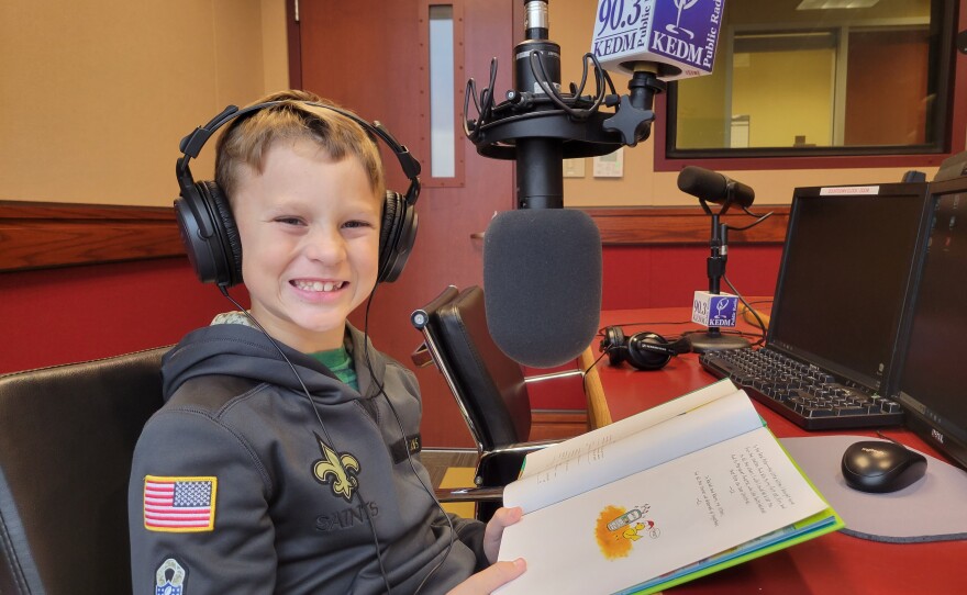 Children read holiday books at KEDM Public Radio