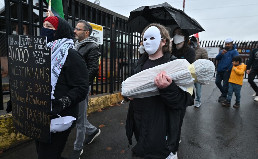 Protesters march outside of the Scranton Army Ammunition Plant.