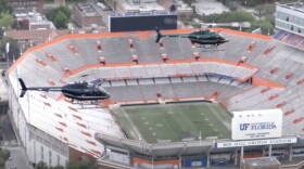 The Gainesville Police Department's helicopter, left, has been grounded in the wake of a funding disagreement between the Alachua County Sheriff's office, whose helicopter is pictured at right, and the city manager's office. (Photo courtesy of Gainesville Police Department)