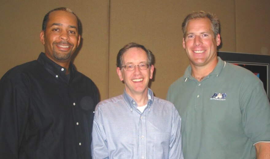 Former Charlotte Hornets player Dell Curry, Mike, and former Carolina Panthers Kevin Donnalley in 2004.