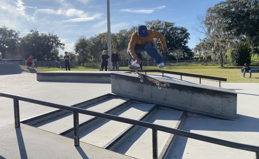 Austin St. Louis, 29, performs a trick over the stairs of the street course at Ocala Skate Park. St. Louis is a park regular and looks forward to the park’s additions. (Ethan Eibe/WUFT News)