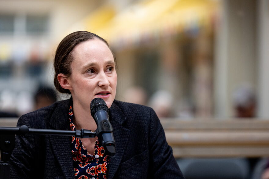 Seattle mayoral candidate Katie Wilson speaks into a microphone.
