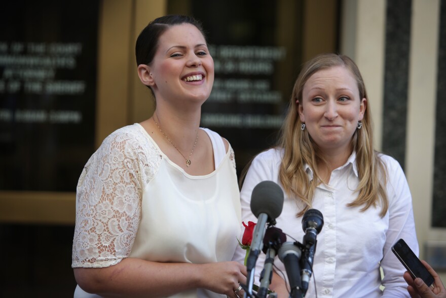 Erika Turner (right) and Jennifer Melsop of Centreville, Va., rejoice as they become the first same-sex couple to marry in Arlington County.