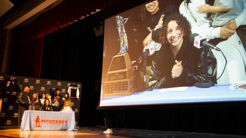 Monterey High School’s Aaliyah Chavez, ESPN’s No. 1 women’s basketball recruit for the class of 2025, stands with her family on stage while being interviewed by ESPN after announcing her commitment to the University of Oklahoma, Friday, March 22, 2025, in Lubbock, Texas