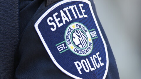 A Seattle Police Department patch is seen on an officer's uniform, July 17, 2016, in Seattle.