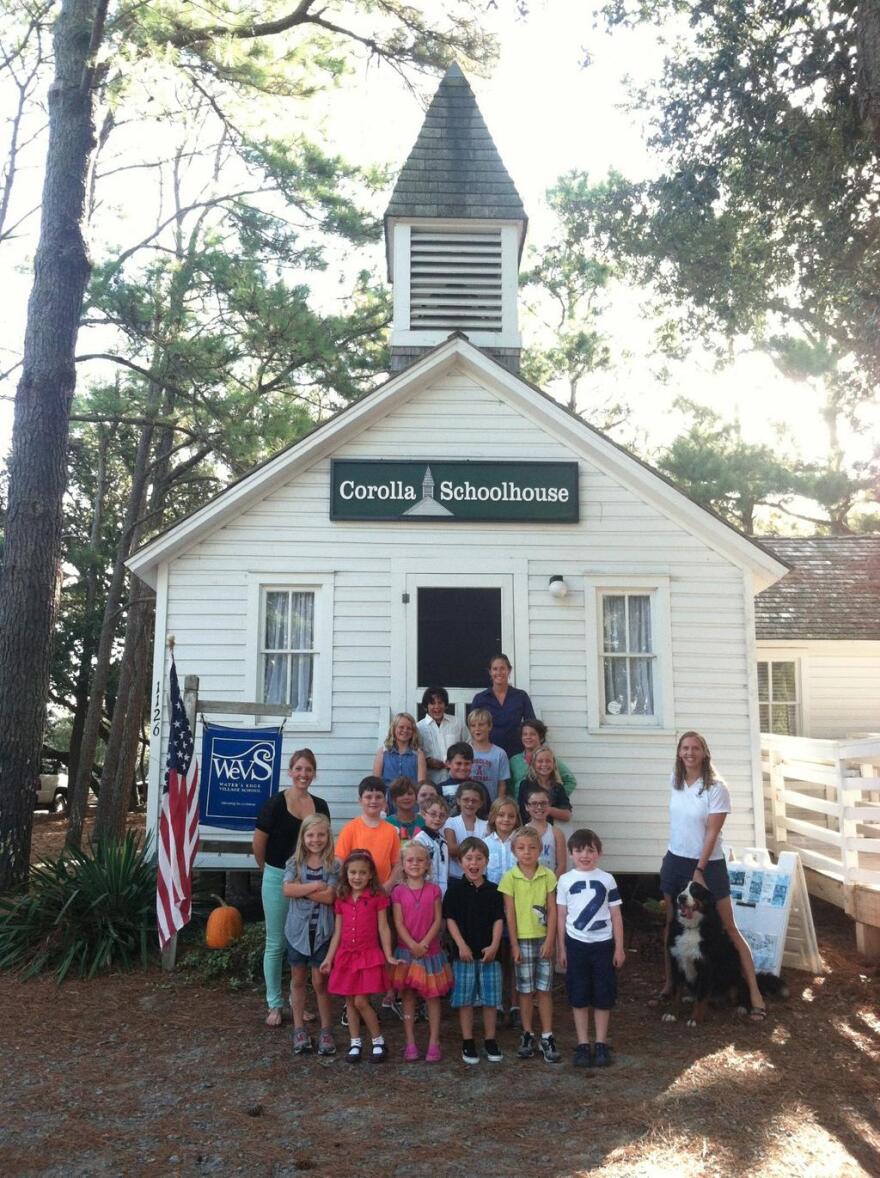 The caption to this tweet: "#teachinginNC Water's Edge Village School in Corolla, NC (NC's smallest public school); our motto: We got this!"