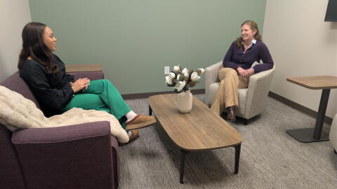 Willow Domestic Violence Center Director of Development Mesha Caldwell (left) and president Meaghan DeChateauvieux sit in one of the new rooms at the center's Family Justice Center.