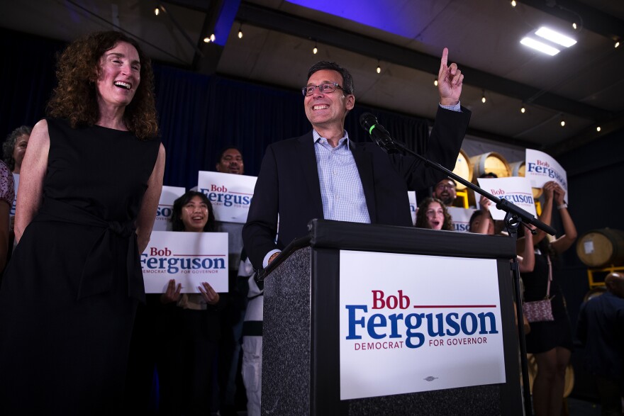 Bob Ferguson, candidate for Washington State governor, arrives to a cheering crowd during a primary election night party on Tuesday, August 6, 2024, at Reuben’s Barrel House event space in Seattle. KUOW Photo/Megan Farmer