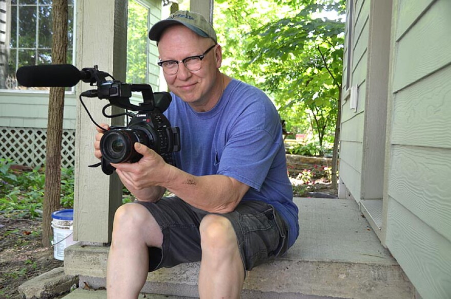 Documentary filmmaker Steve Bognar sits on the steps of the Yellow Springs studio. In 2019, the Academy of Motion Picture Arts and Sciences invited him to join. Bognar has been making documentary films for 35 years.