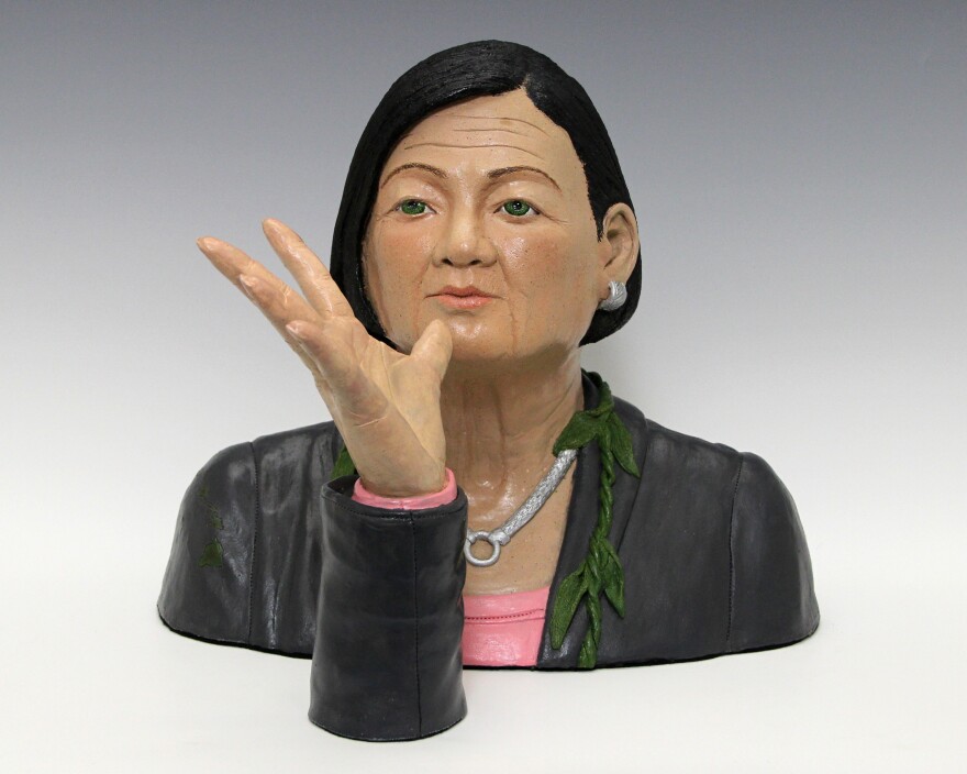 Sculptor of U.S. Sen. Mazie Hirono signing in American Sign Language.