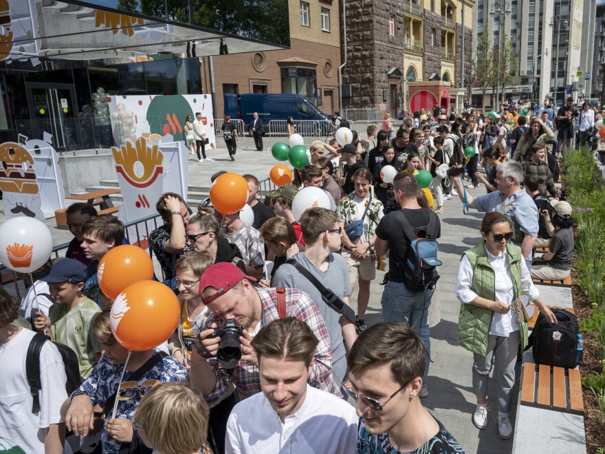 People line up to visit a newly opened fast food restaurant in a former McDonald's outlet in Bolshaya Bronnaya Street in Moscow, Russia on Sunday. Russia's war in Ukraine prompted McDonald's to leave the country and sell its locations there to a franchisee.