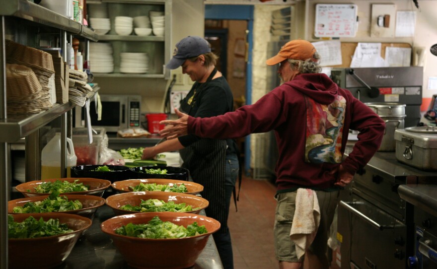 LeeAnn Dodde, left, and Brian Couch work at Phantom Ranch. The kitchen is constantly humming, with breakfast cooks coming in during the wee morning hours, and evening cooks grilling up steaks and ladling seemingly unending pots of stew.
