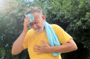 File photo: Senior man suffering from heat stroke outdoors.