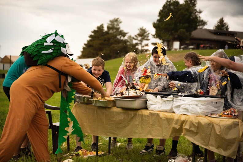 Kids at Camp Rainbow Gold partake in a food fight.