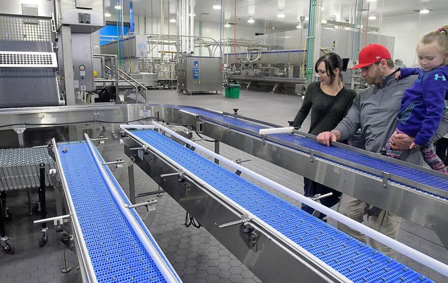 Sam, Jacob and Zoe Philbrick look over the machinery at the new production plant at Casper's Ice Cream in 2017 in Richmond.