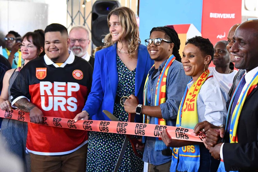 City of Entrepreneurs initiative organizers prepare to cut the ribbon on a marketplace at Union Station timed to coincide with the FIFA World Cup.