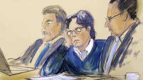 FILE - In this June 18, 2019 courtroom artist's sketch, defendant Keith Raniere, center, sits with attorneys Paul DerOhannesian, left, and Marc Agnifilo during closing arguments at Brooklyn federal court in New York.   Raniere and his lawyers filed a motion Monday, March 9, 2020 for a new trial, arguing that two witnesses perjured themselves when they denied they were planning to sue him after the trial. A jury convicted Keith Raniere in June on all counts of sex-trafficking and coercing women into sex.  (Elizabeth Williams via AP, File)