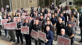 Police and firefighter union members demonstrate outside the Alaska State Capitol in Juneau on April 23, 2024. (Eric Stone/Alaska Public Media)
