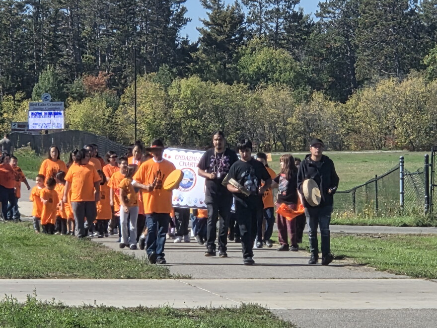 Students and staff of Endazhi Nitaawiging Charter School walk in honor of all children impacted by the residential boarding schools on Sept. 30, 2026, in Red Lake.
