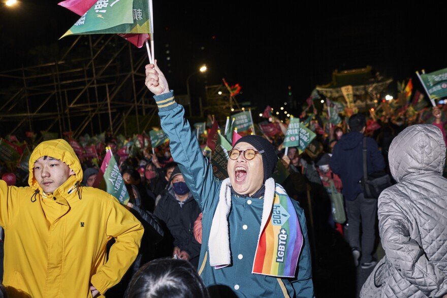 A DPP supporter cheers at a rally.