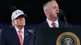 President Donald Trump listens as North Carolina U.S. Senate candidate Michael Whatley speaks at a campaign rally at Pitt–Greenville Airport, Tuesday, Oct. 20, 2026, in Greenville, N.C.