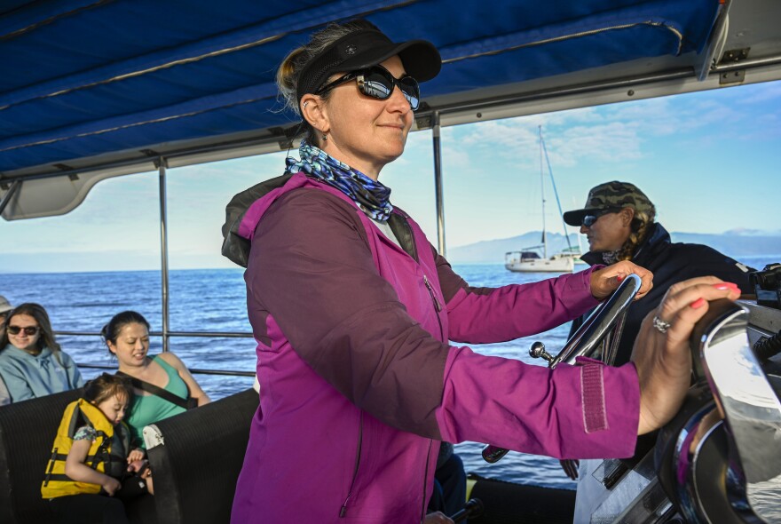 Co-captains Kristina Rau (left) and Sarah Haken (right) say being back on the water brings some normalcy to lives disrupted by the Lahaina wildfires. They ask visitors to keep the focus on the whales and not ask about their losses.