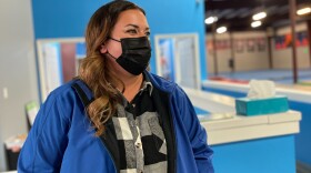 Nurse Sara Dean of Mount Juliet, Tenn., attends her daughter Harper's gymnastics practice. Dean spent nearly two years travelling the country as a nurse, gaining a much higher salary than she could at home.