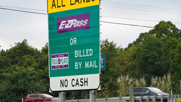 Signs at an entrance ramp inform motorists about toll collection methods on the Pennsylvania Turnpike in this 2021 file photo.