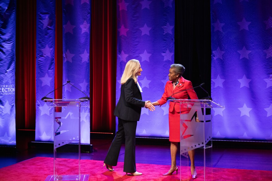 Democrat Abigail Spanberger and Republican Lt. Gov. Winsome Earle-Sears shake hands before starting the only gubernatorial debate at Norfolk State University on Oct. 9, 2025. The debate was marked by Earle-Sears interrupting Spanberger and moderators reminding the Republican candidate to allow her opponent to speak.