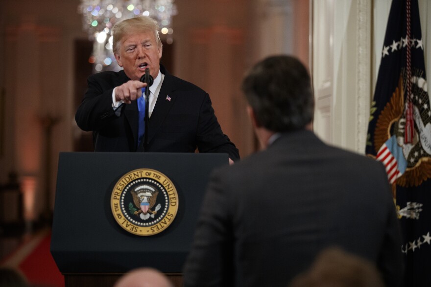 President Donald Trump speaks to CNN journalist Jim Acosta during a news conference in the East Room of the White House, Wednesday, Nov. 7, 2018, in Washington.