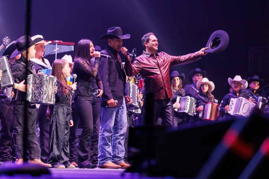 Democratic candidate for the 15th Congressional District in Texas Bobby Pulido stands on stage with his band after "La Ultima Desvelada," his concert in Edinburg, Texas.