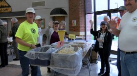 Food 4 Kidz volunteers package meals