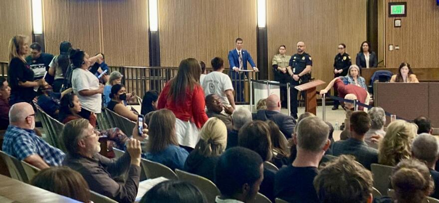 Angry residents shout at Phoenix City Council members during April 5, 2023 meeting.