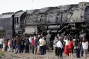 FILE, May 4, 2024 - Train enthusiasts gather to get a look at Big Boy No. 4014, one of the world's largest steam locomotives, Sunday, May 4, 2014, in Salt Lake City. Twenty-five Big Boys were built exclusively for Union Pacific Railroad. Big Boy No. 4014 was delivered to Union Pacific in December 1941. The locomotive was retired in December 1961, and is being taken to Cheyenne, Wyo., for restoration, that is anticipated to take three to five years. 