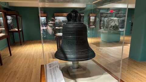A ship's bell recovered from the Henrietta Marie, displaying the name and date, rests in the new slave trade exhibit at the Mel Fisher Museum in Key West.