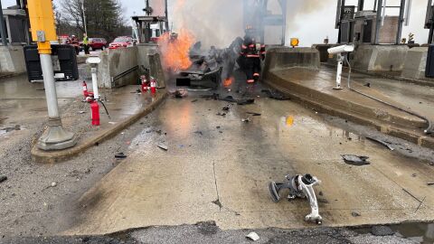 A member of Gov. Ayotte's security team assisted a driver in a fiery crash at the Bedford Toll Plaza on Tuesday.