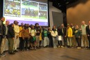 Members of Taft High School's football team posed with the Cincinnati Board of Education and members Cincinnati City Council.