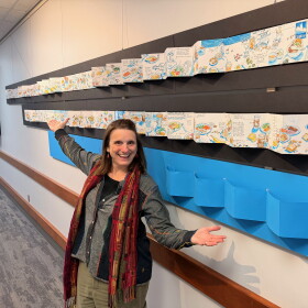 Photo of artist Kristin Pennock in front of her winning ArtPrize entry "Sketchdiet"