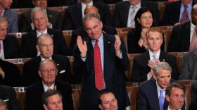 Sen. Tim Kaine, D-Va., applauds during the president's State of the Union address. Not every member of Congress was so moved.