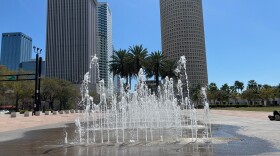A fountain in front of a line of highrises